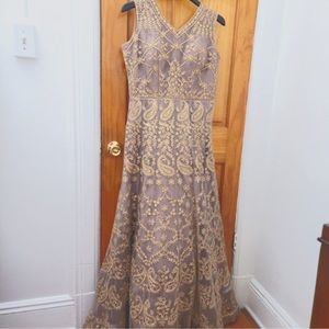 Beautiful Indian gown in mauve purple with gold embellished work all around